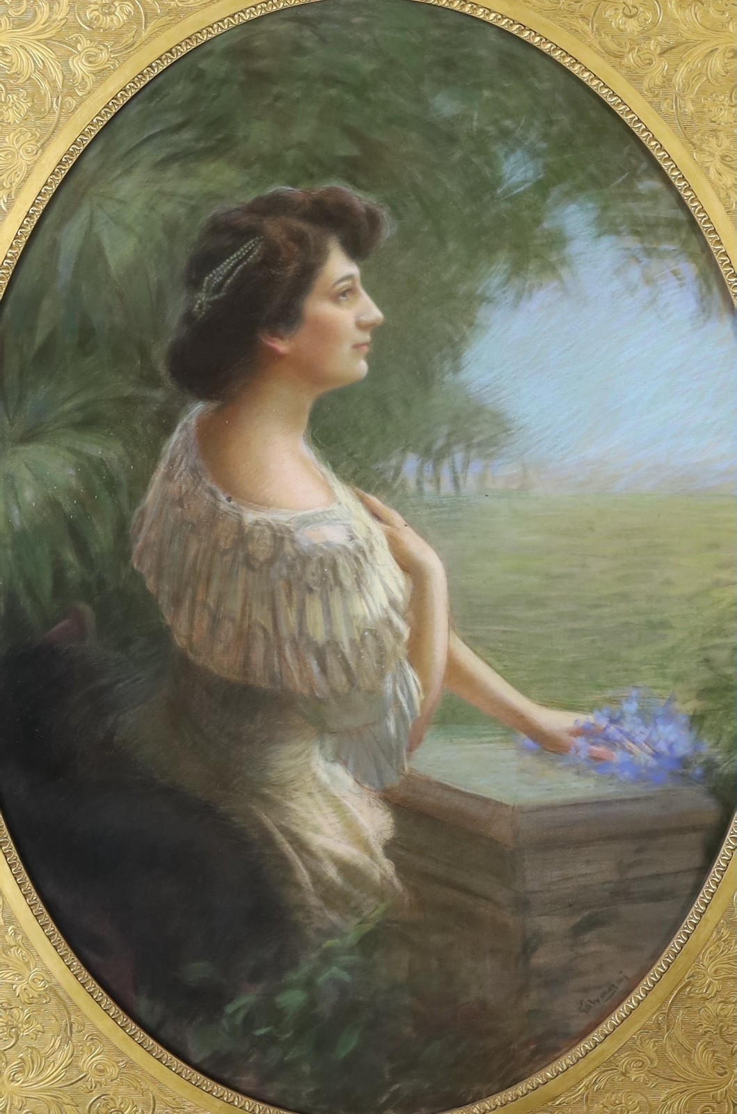 Ugo Galvagni (Italian, b.1867), Portrait of a lady standing upon a terrace, pastel on paper, oval, 120 x 87cm